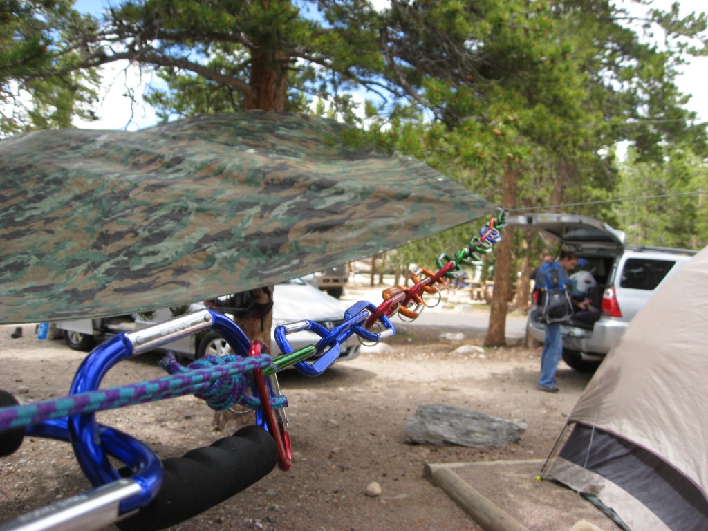 carabiners help hold up tarps over campsites