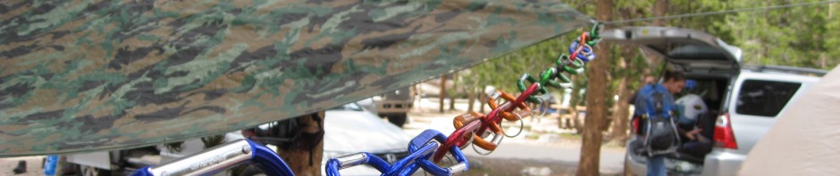 carabiners help hold up tarps over campsites