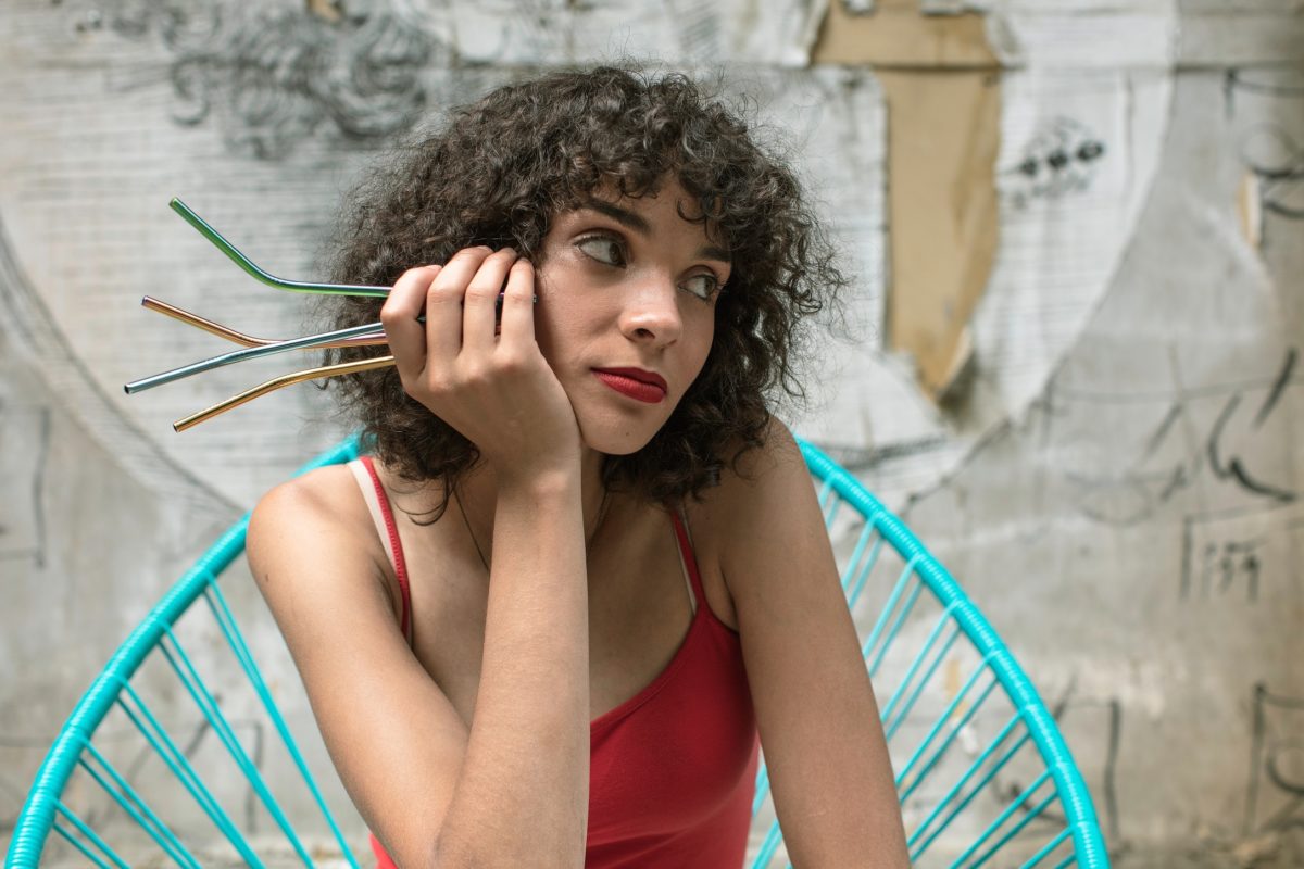 woman holding straws