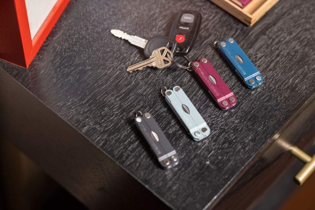 leatherman micra showing multiple color options next to a set of vehicle keys