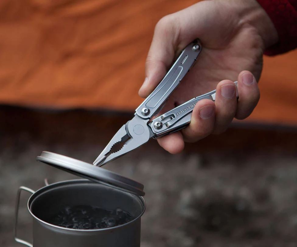 laser engraved leatherman sidekick pliers in use during camping trip